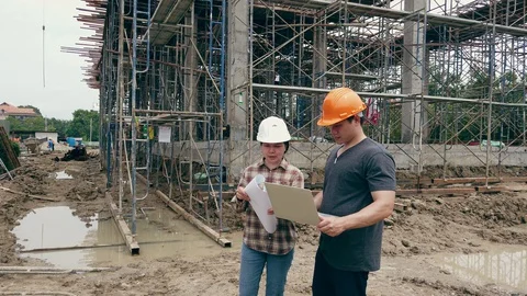 Construction manager and engineer discussing on construction site. Stock Footage 128222251