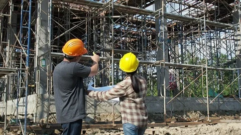 Construction manager and engineer discussing on construction site. Stock Footage 130017126