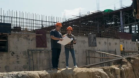 Construction manager and engineer discussing on construction site. Stock Footage 144976484
