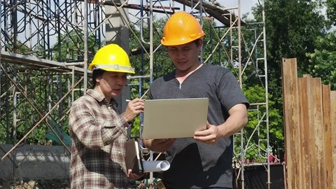 Construction manager and engineer discussing on construction site. Stock Footage 157527002