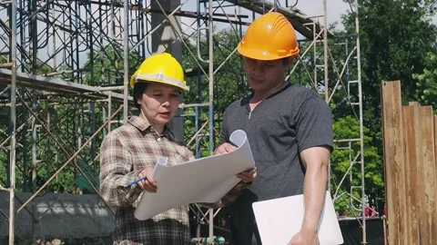 Construction manager and engineer discussing on construction site. Stock Footage 177522885