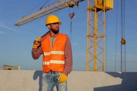 Construction manager and engineer discussing building project on site with .. Stockfoto's