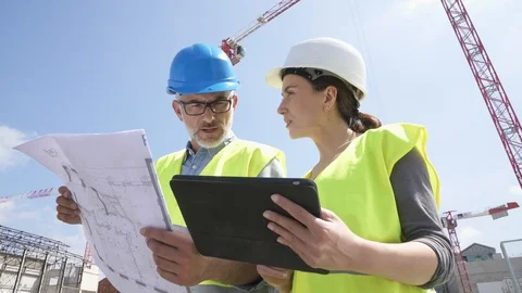 Construction manager and engineer working on building site Stock Footage 89515871