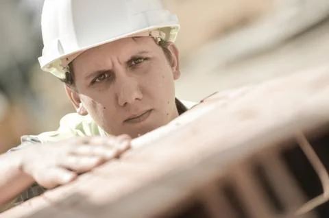 Construction manager checking building materials on site Foto stock