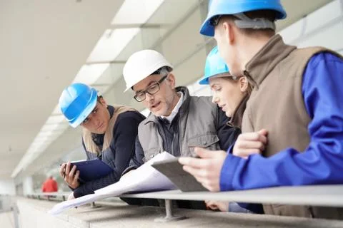 Construction manager giving instructions to training students Stock Photos