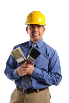 Construction manager holding paintbrushes Stock Photos