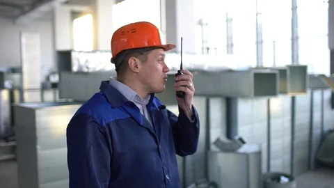 Construction manager talking over radio. slow-motion Stock Footage 85873403