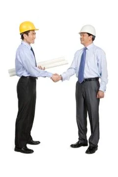 Construction managers in hard hats Stock Photos