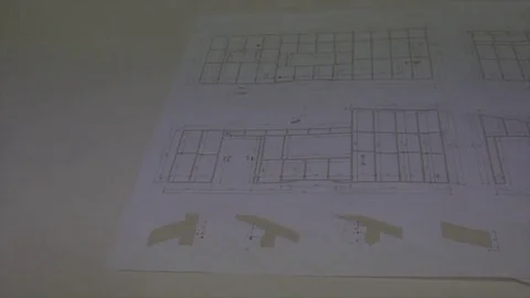 Construction maps or building maps on a working table Stock-Footage 82868356