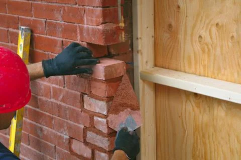 Construction mason brick wall builder worker bricklayer masonry concrete tool Stock Photos
