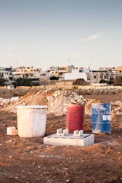 Construction material in a Maltese field 库存照片
