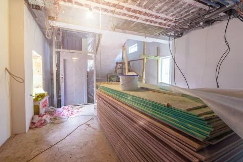 Construction materials and sheets of plasterboard or drywall are prepared for Stock Photos