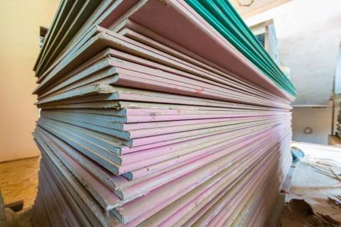 Construction materials and sheets of plasterboard or drywall are prepared for Stock Photos