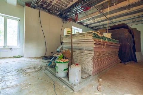Construction materials and sheets of plasterboard or drywall are prepared for Stock Photos