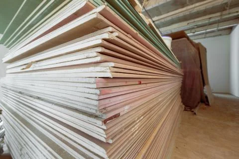 Construction materials and sheets of plasterboard or drywall are prepared for Stock Photos