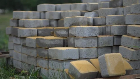 Construction Materials. Gray stones for laying pavers on the path lie a Video stock 92312283