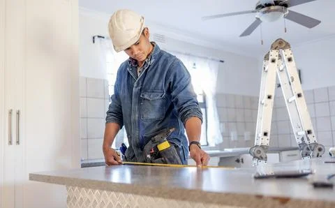 Construction, measurement and handyman doing home repair, renovation and Stock Photos