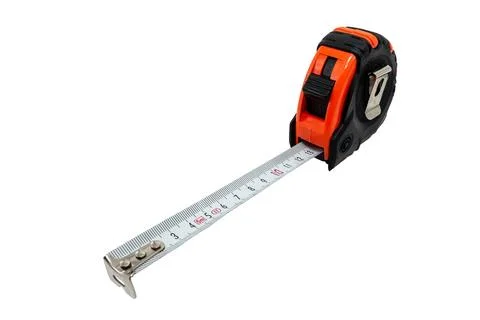 Construction measuring tape on a white background. Roulette Foto stock