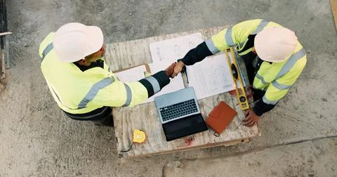 Construction, men and architect with handshake outdoor for site handover, legal Stock Photos