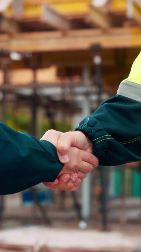Construction, men and shake hands for engineer collaboration with agreement Stock Footage 336223546