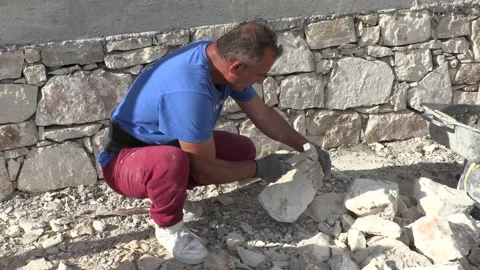 Construction men building a stone wall Stock Footage 196242763