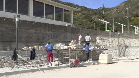 Construction men building a stone wall Stock Footage 196243011