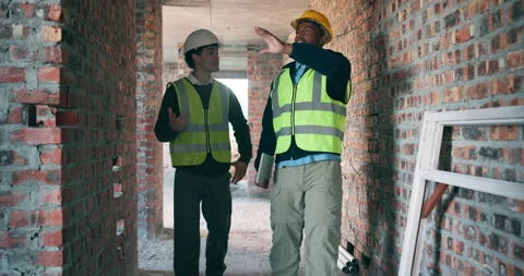 Construction, men or site inspection with pointing for masonry safety, wall Stock Footage 337156752