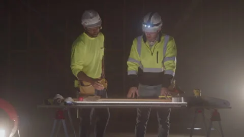 Construction Men Shake Hands While Working Together On Job Site Stock-Footage 270390967