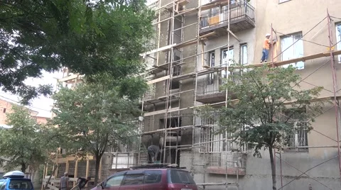 Construction men standing on weak scaffolds in Tbilisi, Georgia Stock Footage 66586296