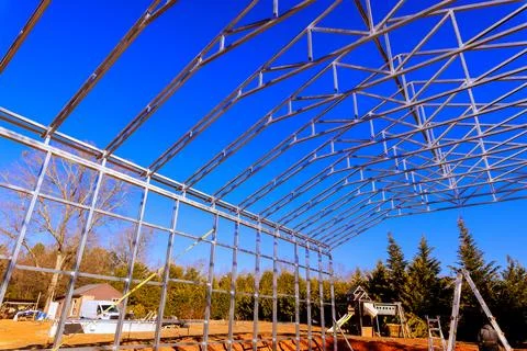 Construction of metal frame structure in rural area Stock Photos