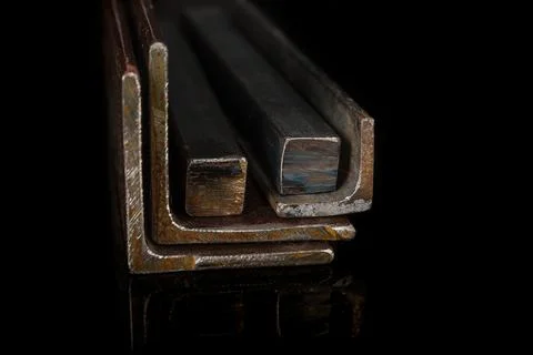 Construction metal profile on a black background Stock Photos