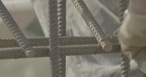 Construction, metal rods, working with metal, construction gloves Stock Footage 303407697
