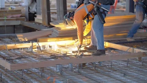 Construction metal worker welding steel on a construction site creating sparks Stock Footage 270879434