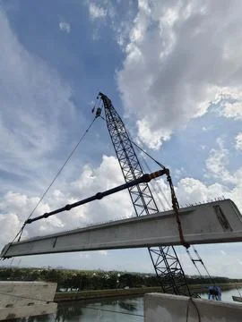 A construction method of lifting precast girder using a single crane Stock Photos