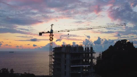 Construction of modern apartment building at sunset by sea Stock-Footage 292808191