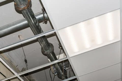 Construction of a modern false ceiling in the building of an old building Stock Photos
