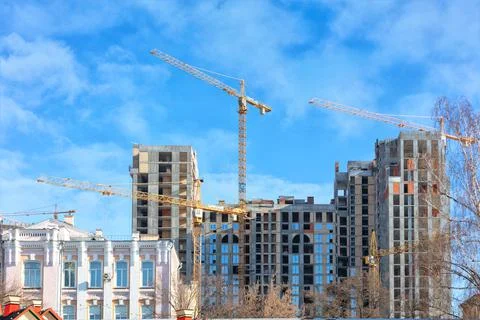 Construction of modern residential complexes in the old urban areas of the ci Stock Photos