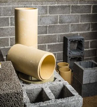 Construction of modular ceramic chimney in the house Stock Photos