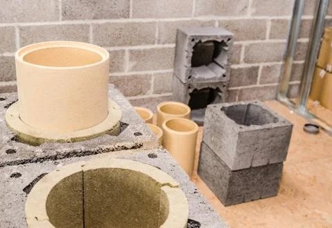 Construction of modular ceramic chimney in the house Stock Photos
