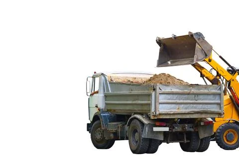 Construction moment.Loading road debris with an excavator into dump truck Stock Photos