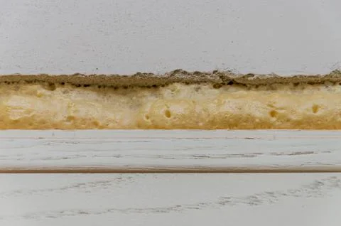 Construction mounting foam at the junction of the wall and doors Stock Photos