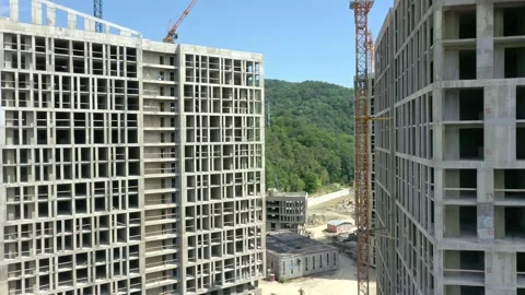 Construction of a multi-storey apartment building. Aerial video. 動画素材 238015987