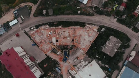 Construction of a multi-storey brick residential building of red color next to Stock Footage 126002118