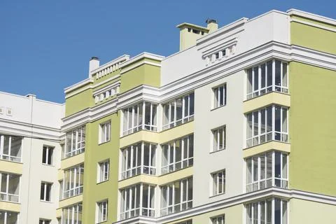 The construction of a multi-storey building. Facade of a new house with glass 스톡 사진