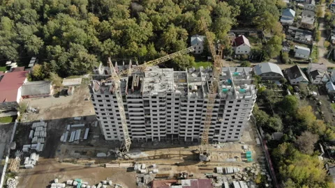 Construction of a multi-storey building in the green zone. Stock Footage 96352197