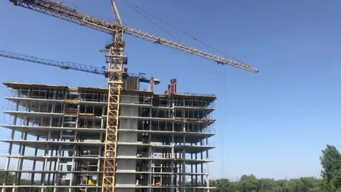 Construction of a multi-storey building. The process of building a large multi Stock Footage 203815171