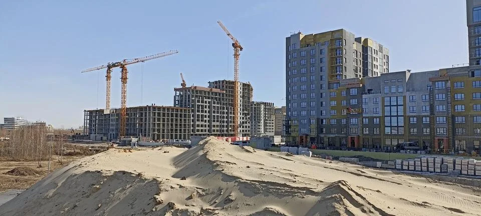 Construction of multi-storey buildings on a construction site Stock Photos