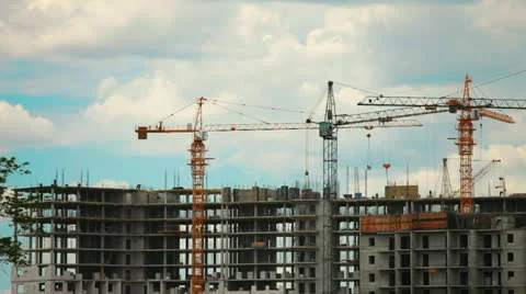 In construction of multi-storey buildings running a lot of cranes and workers Stock Footage 24298918