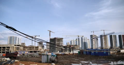 Construction of multi-storey district. Wiring site stretched on temporary poles Stock Footage 244746764