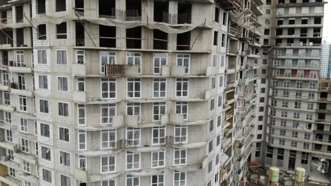 Construction of a multi-storey residential building in the city. close up view Stock Footage 247501738